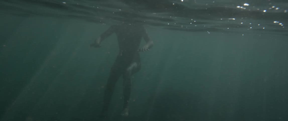 People Swimming On Beach