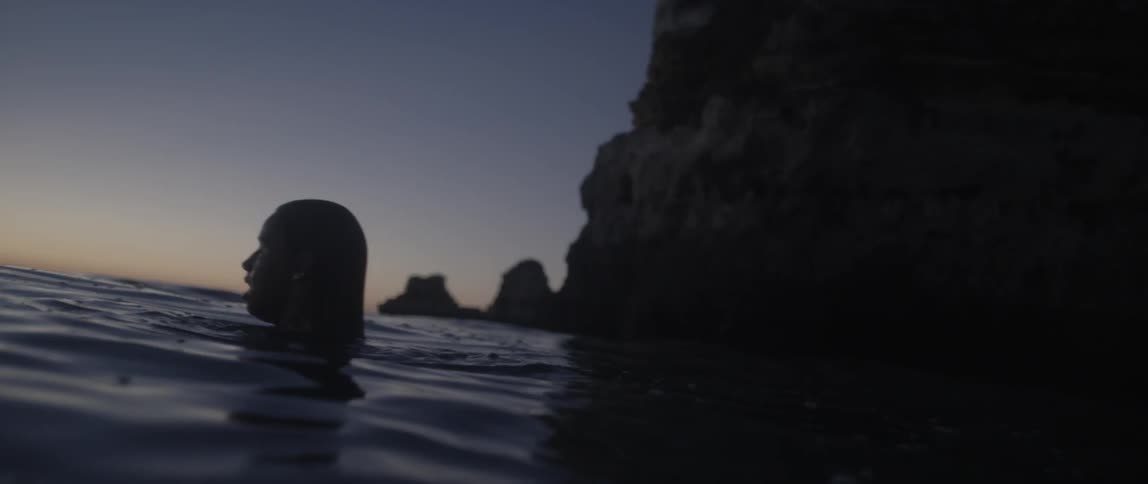 People Swimming On Beach