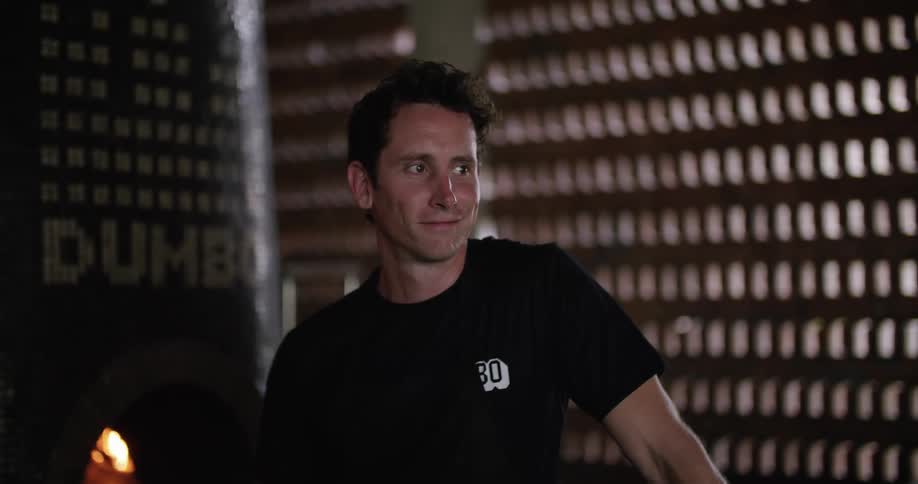 Man standing near a pizza oven on a restaurant