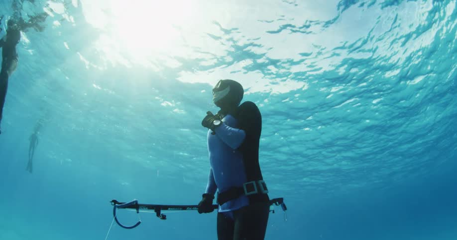 A diver slowly surfacing