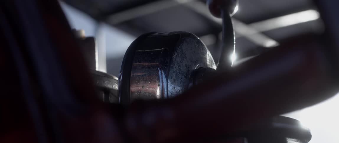 Close-up of a captains wheel turning on a ship