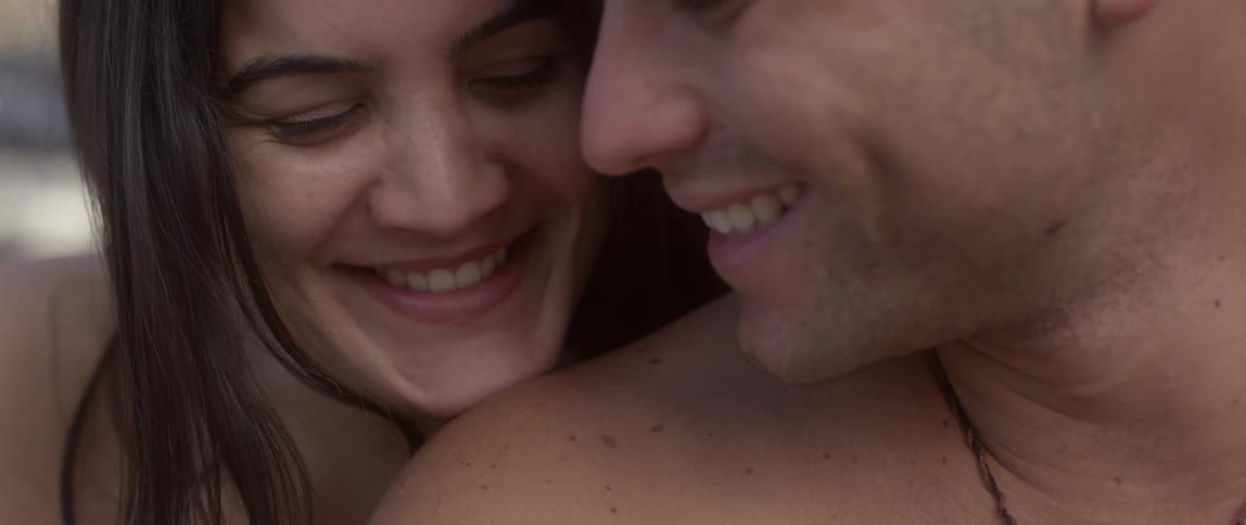 Close-up of a couple smiling while close to each other