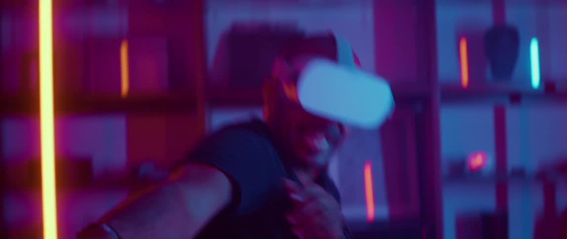 Man wearing black shirt and virtual reality plays sword fighting game