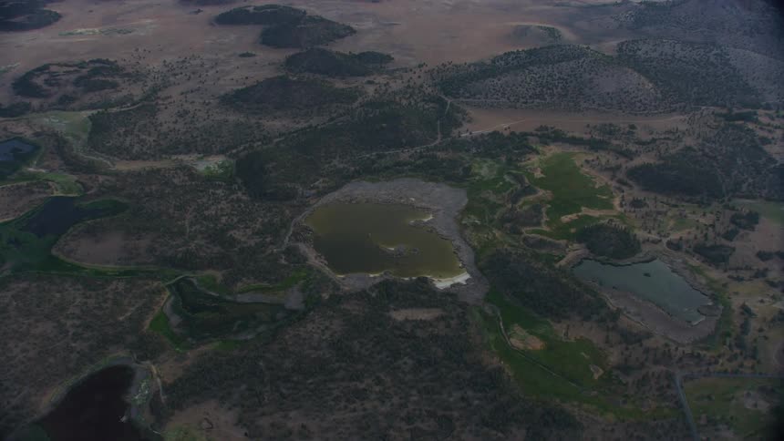 An Alkaline pond begins to dry up under intense summer heat in the western USA