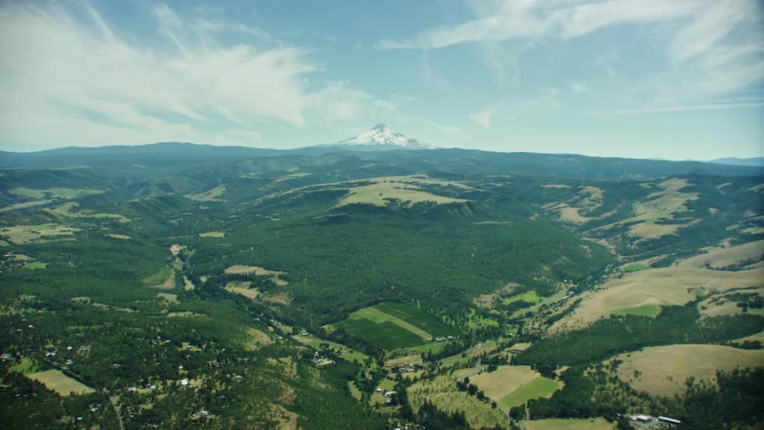 A giant mountain sits proudly in the background as two river valleys come together perfectly in the foreground
