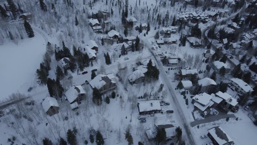 Aerial view of snowy suburban area