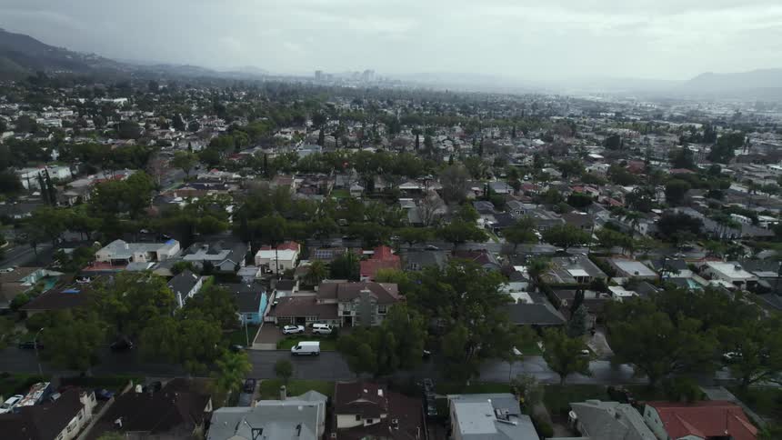 An aerial view of homes in a neighborhood on a cloudy day