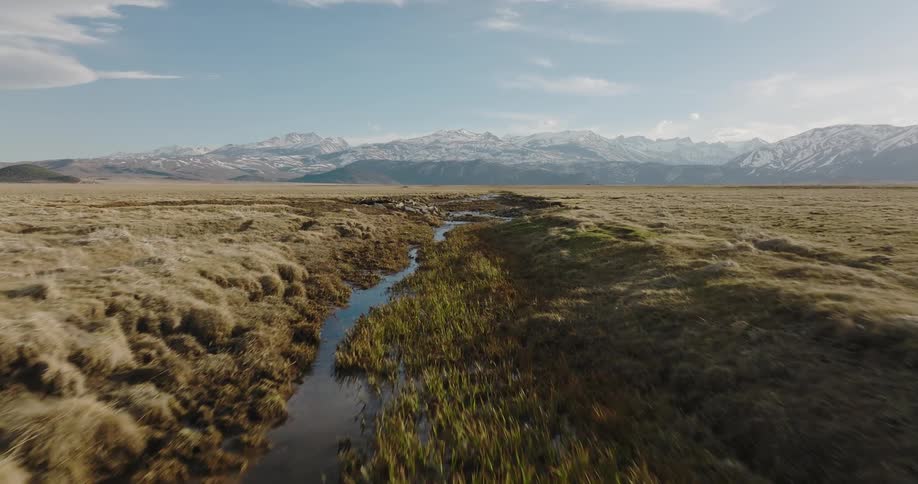 Aerial view of the tundra is displayed during midday