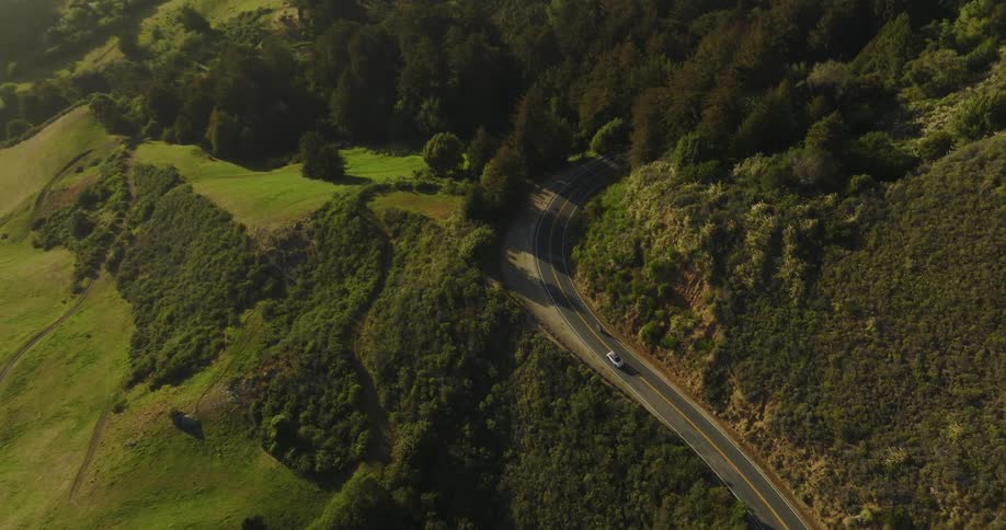 Aerial view of cars driving on mountain highway