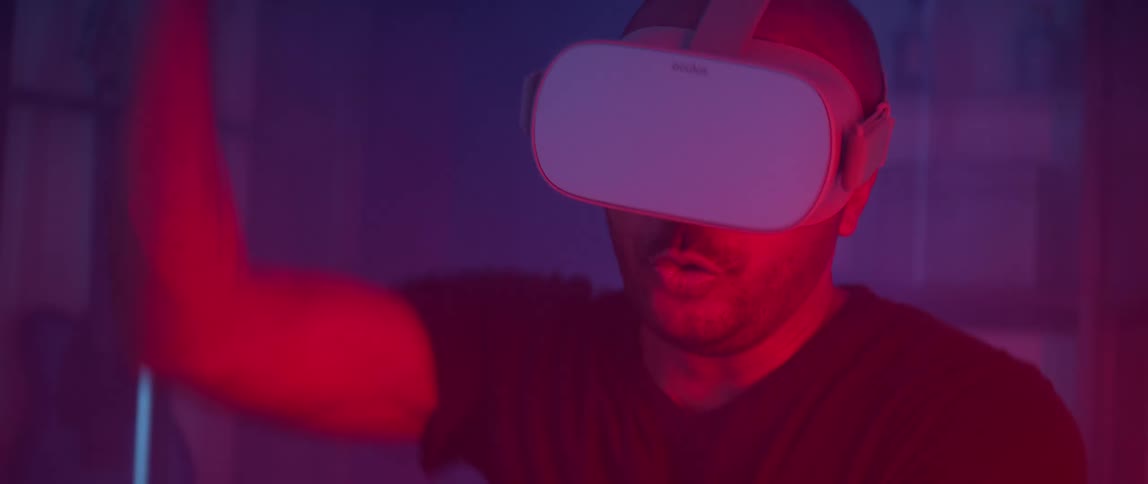 A man mimics throwing an item while playing a virtual reality game