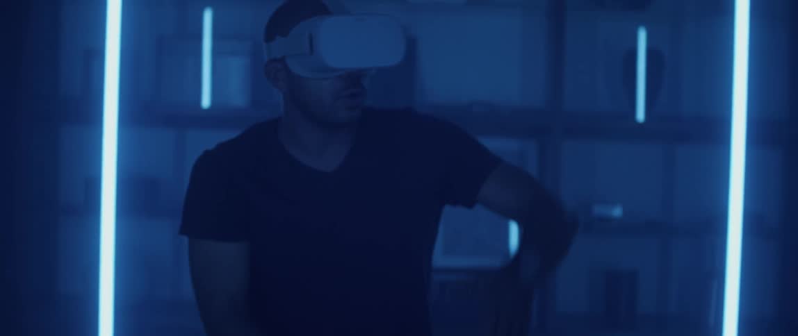 A man is using a virtual reality headset