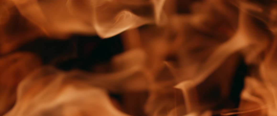 The fire moves around in the dark