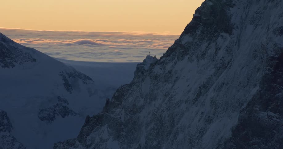 Aerial view of snow covered mountains are displayed