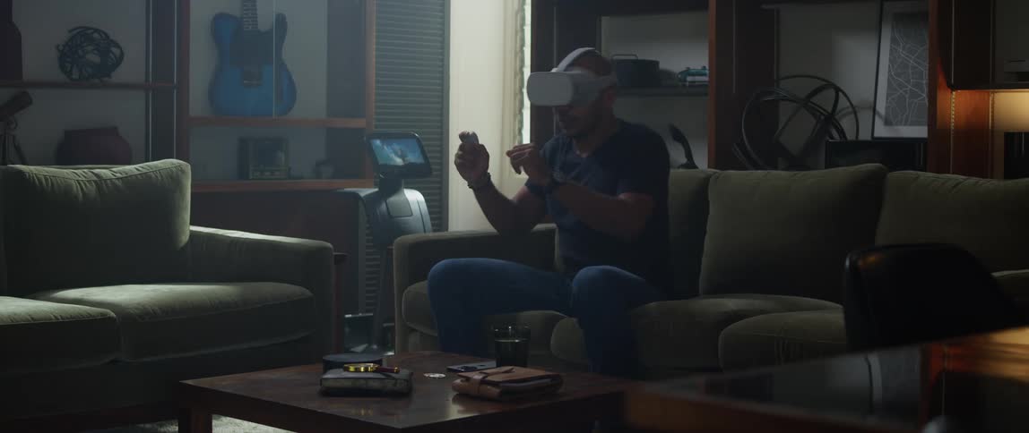 A man is playing virtual reality at home