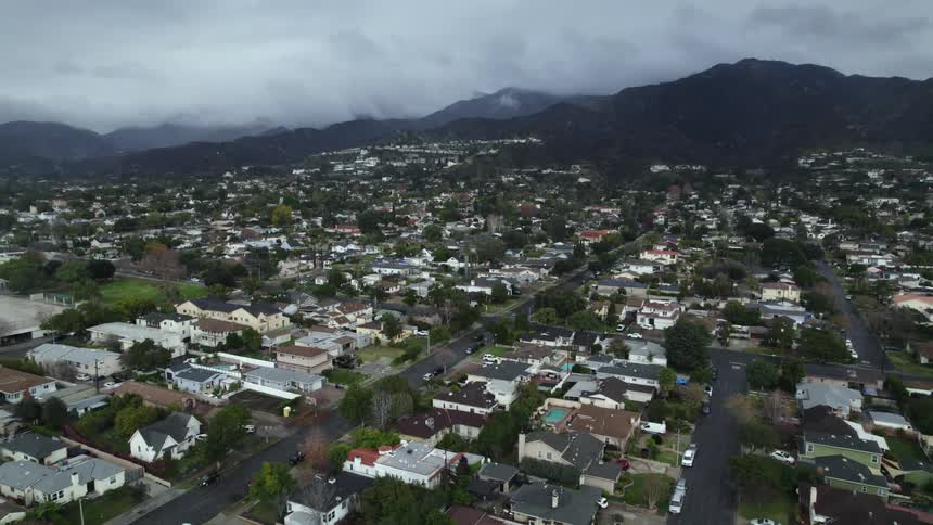 An aerial view of homes in a neighborhood on a cloudy day