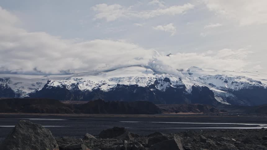 Clouds flow over the volcano mountains Eyjafjallajökull, Iceland