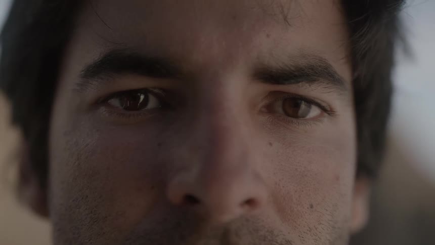 A man is staring at the camera