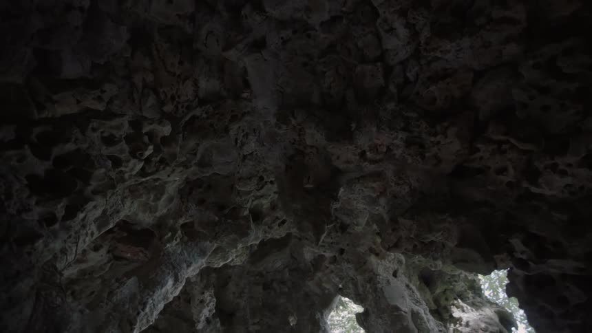 The ceiling of a cave and its formations are seen during daylight