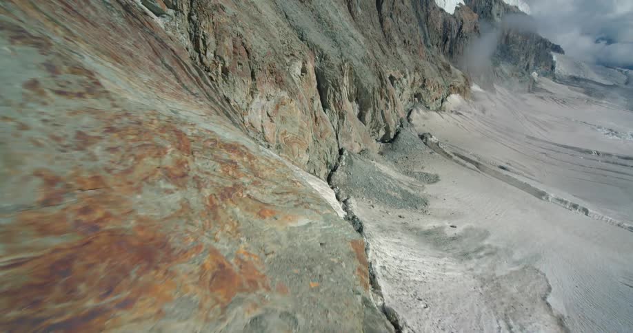 The sheer slope of an arid mountain during the day