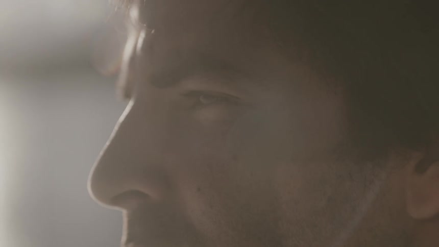 A man blinks on a sunny day