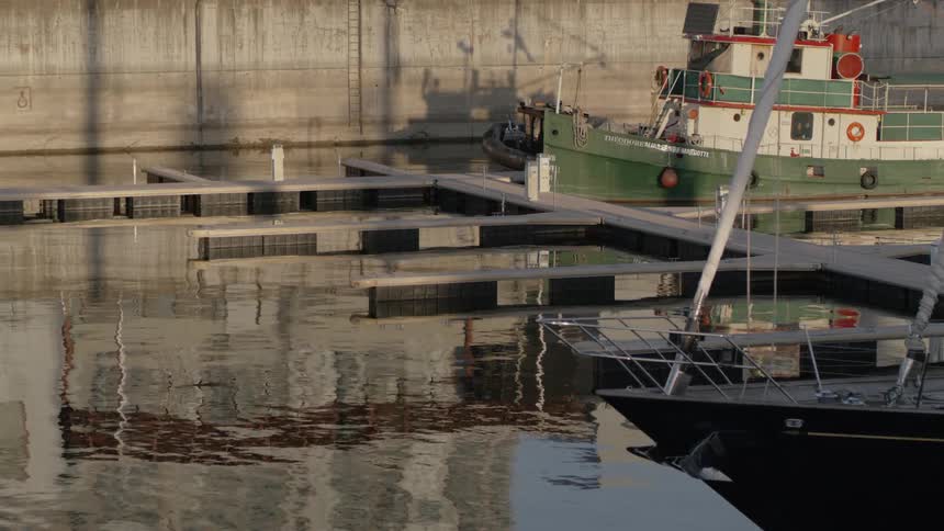 Boats docked in a marina during the day