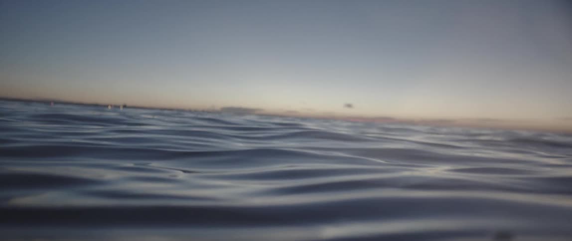 People Swimming On Beach