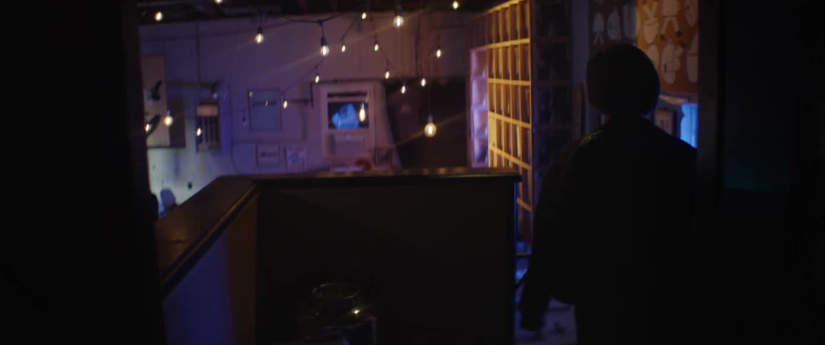 A band playing music in a bar with people dancing