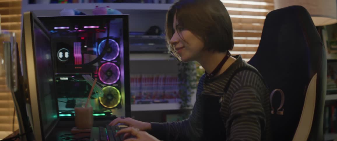 A woman is typing on her computer