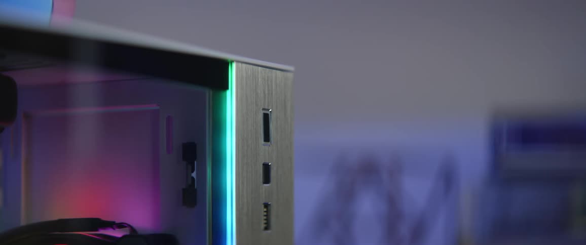 A girl reaches over and pushes a button on her computer and the lights come on