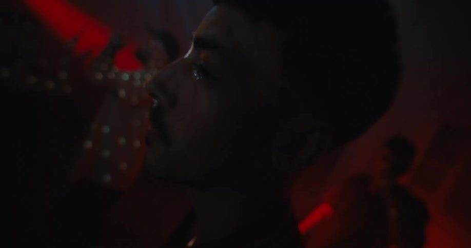 A group of people are dancing in a night club