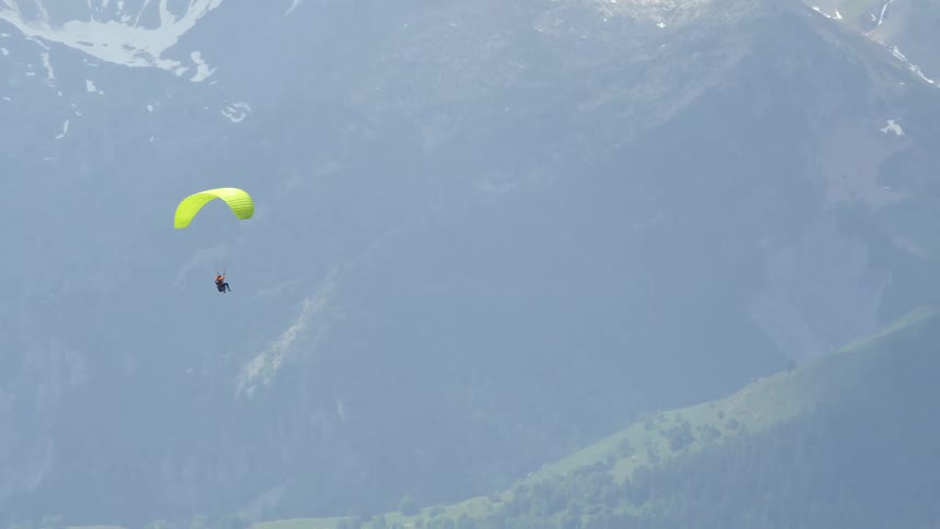 A woman paragliding outdoors