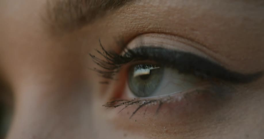 Close up of a womans eye with mascara on the eyelashes