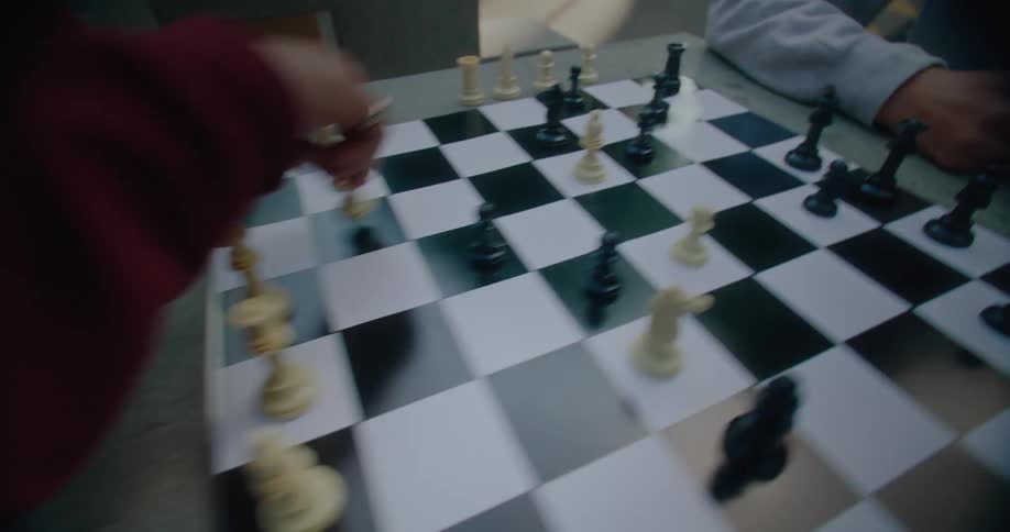 Two people are playing a chess game