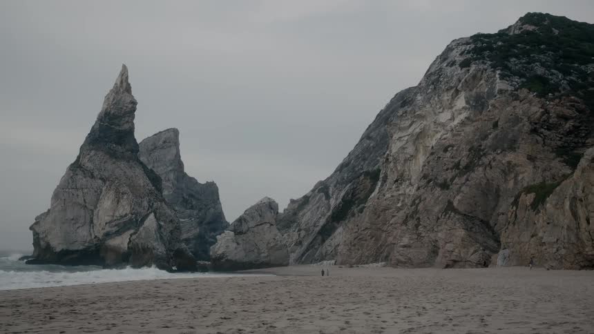 Very tall and pointy rock formations on a beach