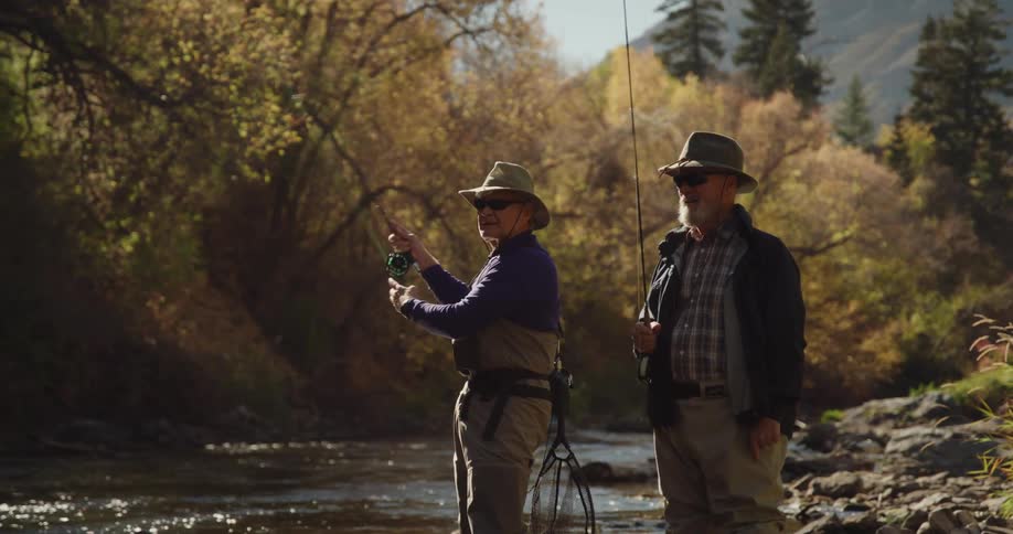 Two men are fly fishing in the river