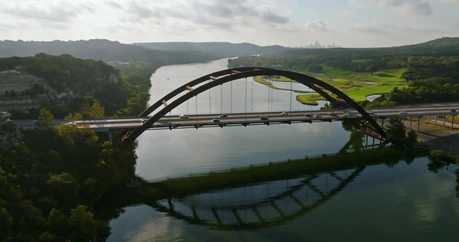 Vehicles drive over the bridge