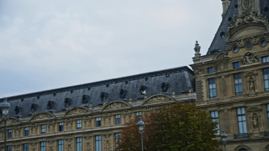 A view of a large building is displayed during spring
