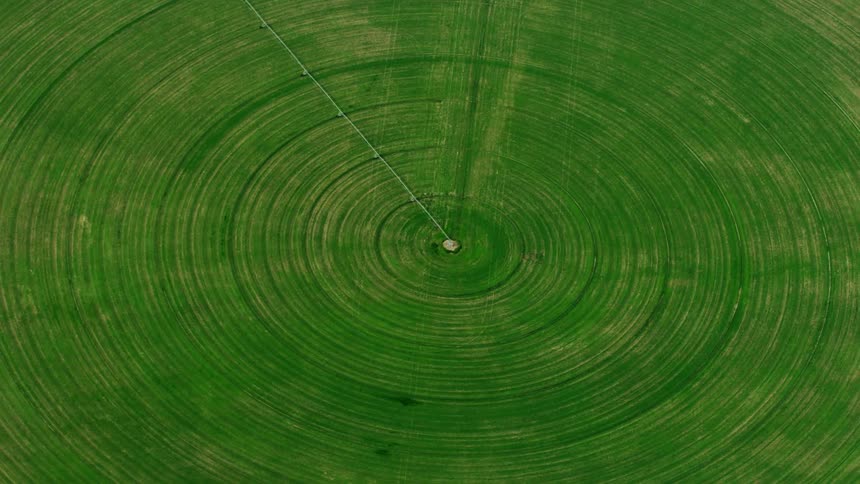 A high energy aerial cross over of a center pivot round field in rural America