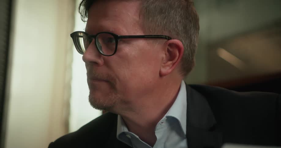 A man sitting in a room talking