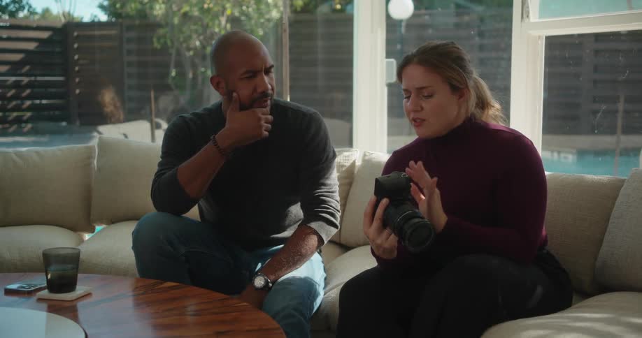 Man and woman are sitting on a couch together