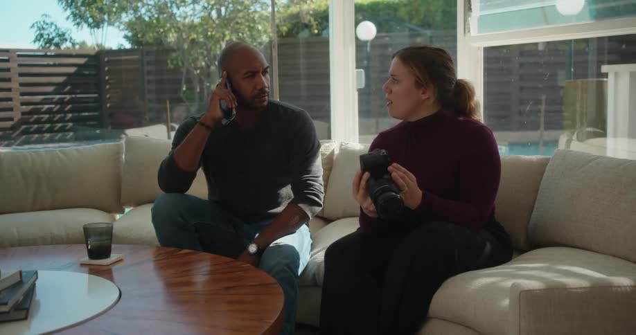 A couple sitting outdoors talking