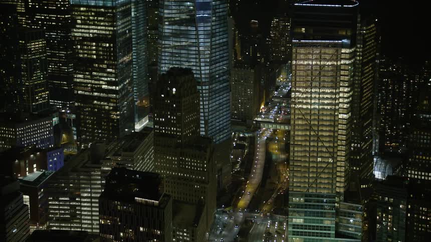 A breathtaking aerial view of the World Trade Center memorial in Lower Manhattan New York City during the winter night