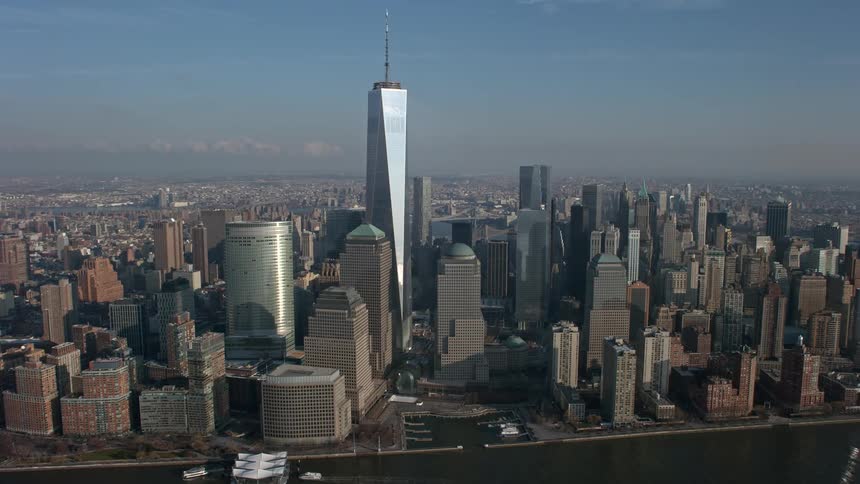 A stunning 4K aerial view of Freedom Tower and World Trade Center buildings in Lower Manhattan New York City during winter