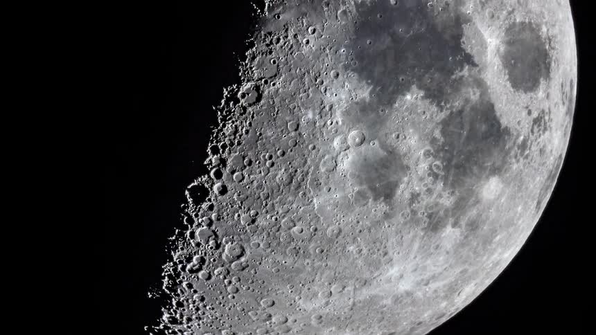 Craters are seen on the surface of the moon as it moves in space