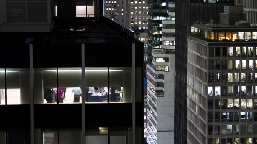 Time lapse view of people walking in an office building
