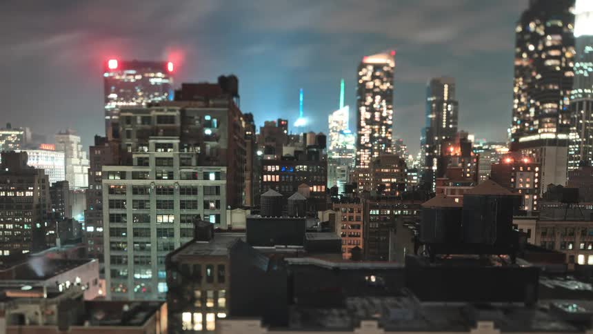 Lights turn on andoff in the city buildings and skyscrapers in the city at night