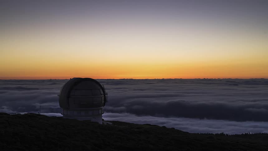 Time lapse view of the sun setting in the ocean sky