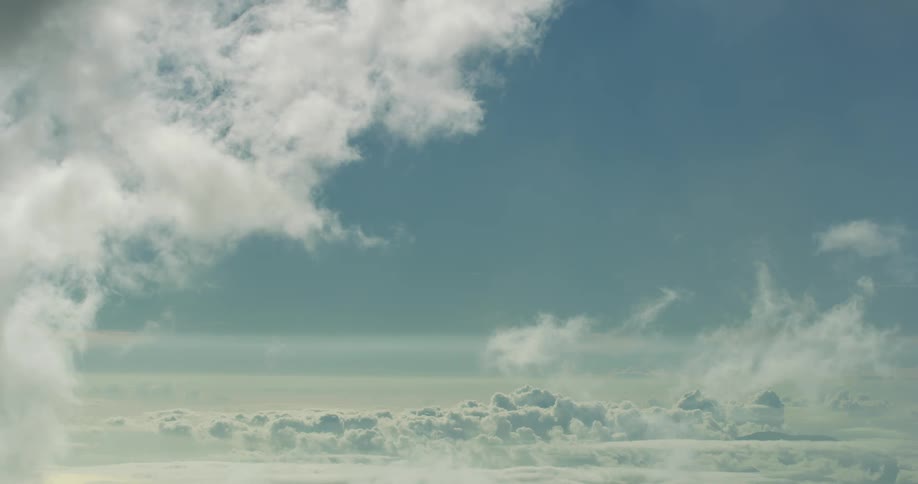White clouds floating on a tranquil peaceful blue sky