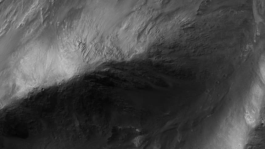Top down aerial view of the hills on a deserted terrain filmed in black and white