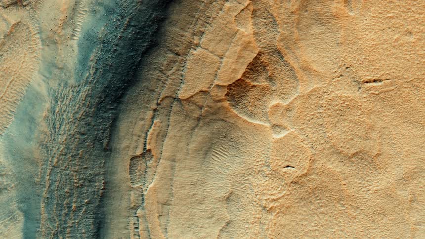 Top down aerial view of a colorful rugged deserted terrain